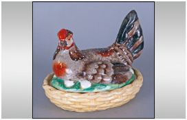 Staffordshire 'Hen on Nest' Egg Box, the nest represented by a pale yellow wicker basket, the