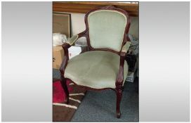 French Style Armchair, mahogany frame with light green upholstered seat and back. On carved cabriole