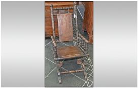 Antique American Childs Rocking Chair, uses spring coils but restraining chain needs replacement.