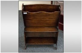 1920s Oak Newspaper Stand With Single Book Shelf Below. Height 26 inches, width 17.75 inches.