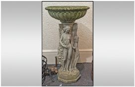 Stone Bird Bath, with classical figural decoration. 35 inches in height.