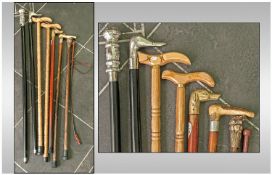 Collection Of 8 Walking sticks. With cast metal handles depicting ducks, frogs, dogs heads, etc.