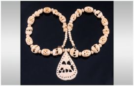Early 20th Century Carved Bone Necklace, with pendant drop.