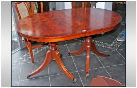 A Reproduction Georgian Style Dining Table, D end top with one loose leaf, on Regency tripod base,
