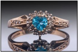 9ct Gold Dress Ring, Set with a Central Blue Topaz Surrounded By Small Diamonds, Fully Hallmarked,