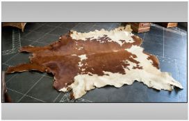 Large Cow Hide Rug, 78 by 71 inches.