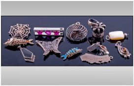 Collection Of 12 Silver Charms.