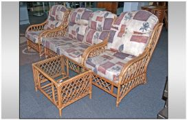 Rattan And Bamboo Three Piece Conservatory Suite with upholstered cushions. Comprising two seater