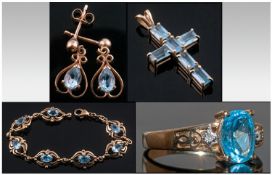 9ct Gold Suite Of Jewellery. Comprising ring, pendant, earring and bracelet. All set with blue