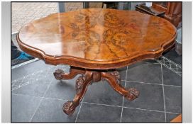 An Extremely Fine Victorian Shaped Top Walnut Yew Table, on an elaborate carved four leg base. The