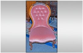 Victorian Nursing Chair, upholstered in pink fabric with teak frame.