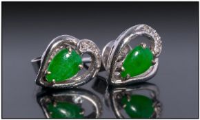 18ct White Gold Jadeite And Diamond Stud Earrings. Set With Central Jadeite Stones With Diamond