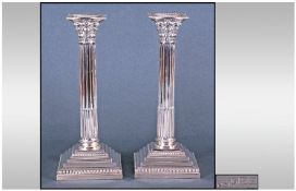 A Pair Of Good Quality Corinthian Candlesticks with detachable beaded sconces leading to fluted