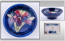 Moorcroft Small Footed Bowl. Orchids design on blue ground. Height 1.5 inches, Diameter 4.5