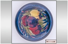 Moorcroft Small Footed And Inverted Bowl. Plums design on blue ground. Diameter 4.25 inches.