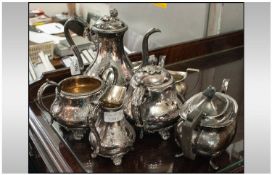 Regency Style Four Piece Silver Plated Tea Service, with engraved floral decoration and acorn and