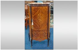 A French Ormalu Mounted Walnut and Kingwood Inlayed Bombe Fronted Side Cabinet with a floral inlayed