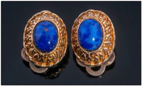 Early 20th Century Clip On Earrings, Set with Polished Lapis Lazuli Coloured Stones. Gilt Metal