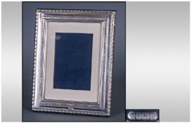 A Silver Photo Frame Of Good Quality with square & beaded borders. Hallmark Sheffield 1996, 9x7".