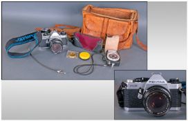 Pentax MG Camera with leather case and accessories.