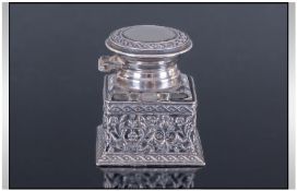 Edwardian Small Desk Hinged Top Silver And Glass Inkwell, sitting within a fine and ornate silver