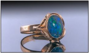 9ct Dress Ring, Set With An Opal Triplet, Showing Flashes Of Greens And Blues. Stamped 9K. Ring Size