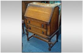 1930s Oak Fall Front Bureau, with 2 draws below, on turned baluster legs with cross stretchers. 28