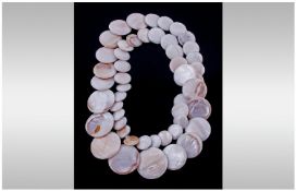 Mother Of Pearl Disc Graduated Necklace. Length 30 inches.