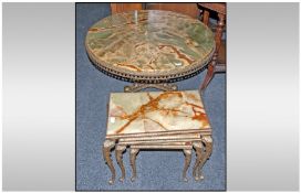 Large Onyx Ormalu Based Circular Table, 35 inches in diameter together with similar nest of tables.