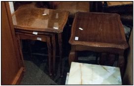 Two Sets Of Three Walnut Queen Ann Leg Coffee Tables, with glass tops, with an oblong shaped
