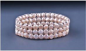 Ivory White Cultured Button Pearl Bracelet comprising three rows of button pearls threaded onto