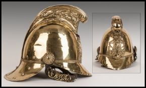 An Antique Brass Firemans Helmet Made By Merryweather & Sons, London, Firearms Outfitters.