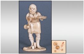 Japanese Fine Nineteenth Century Signed Ivory Figure of a man holding a bowl in his left hand.