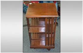 Edwardian Revolving Mahogany Book Stand. With slatted sides and two shelves. Width 18 inches, 33