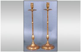 Pair Of Brass Candlesticks With Drip Tray. Each 17 inches in height.