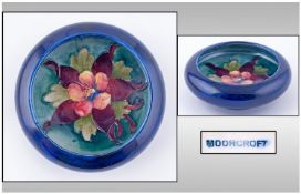 Moorcroft Small Footed Bowl. Orchids design on blue ground. Diameter 5 inches. Good condition all