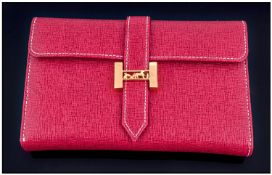 Red Leatherette Ladies Purse, with gold Coloured clasp. Complete with outer box, marked Hermes