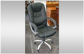 Contemporary Swivel Office Chair, chrome frame, on castors with leatherette upholstery.