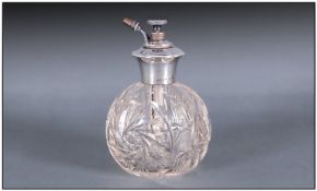 An Edwardian Silver Topped And Cut Glass Globular Shaped Atomizer. Marked sterling silver. Height