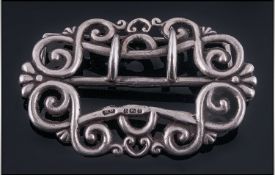 A Silver Buckle, Hallmarked Birmingham 1906, Makers mark W.D of fancy loop form. 3x2"