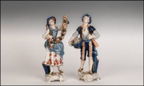 German Late 19th Century Hand Painted Pair Of Flower Seller Figures. Dressed in Bivarian costume.