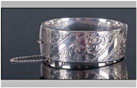A 1960's Hinged Silver Bangle with Engraved Decoration. Hallmark Birmingham 1960 with Original
