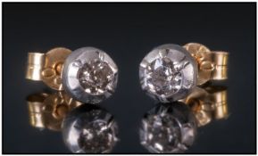 Pair Of Diamond Stud Earrings. Estimated Diamond Weight 0.30cts. Unmarked.