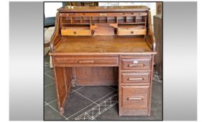 Early Twentieth Century Panelled Oak Roll Top Office Desk with fitted compartments to top, above