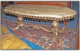 French Style Brass Framed Shaped Onyx Topped Coffee Table. Scroll Pierced Form, 47 x 22 Inches.