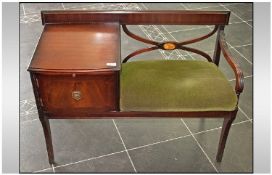 Mahogany Telephone Seat with green upholstered seat.