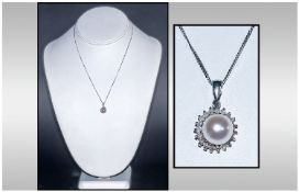 Ladies 9ct White Gold Pendant And Chain, Set with a Central Pearl Surrounded By Round Brilliant