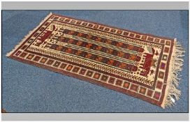 Eastern Woolen Rug. Runner. Aztec symmetrical design. Stylised lions, various shades of reds on buff