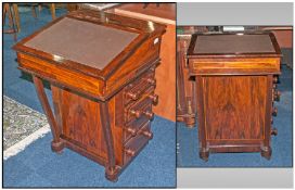 A Rosewood Inlayed Davenport Desk in the Regency Style with a lift up flap and fitted interior, a