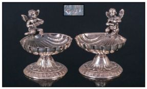 A Victorian Pair of Silver 18th Century Style Miniature Shell Dishes with Cherub Figures to the Top.